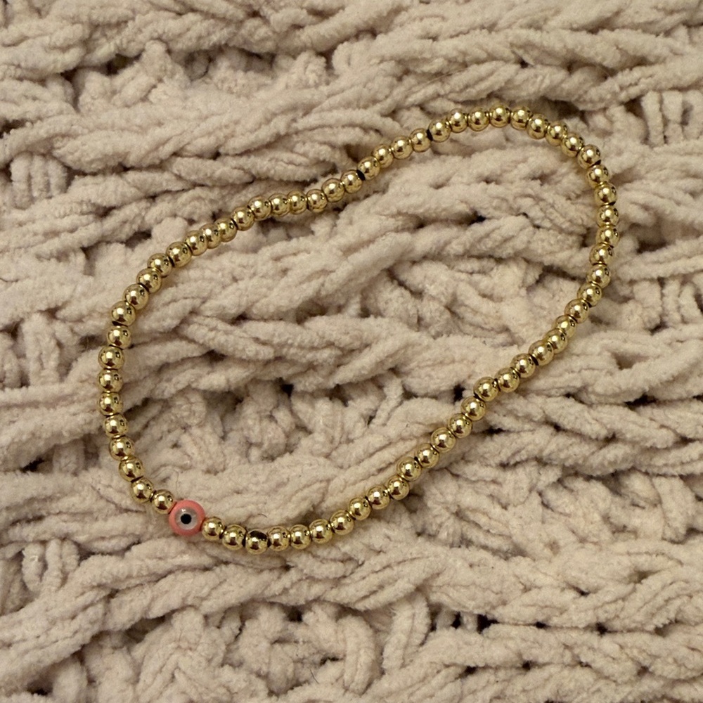 Gold Beaded Bracelet with Pink Evil Eye Accent